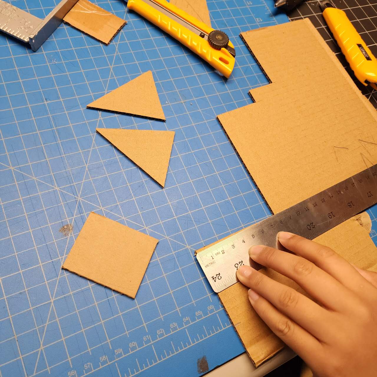 We then measured the dimensions, plotted the placements, and carved out the structure of the phone case.