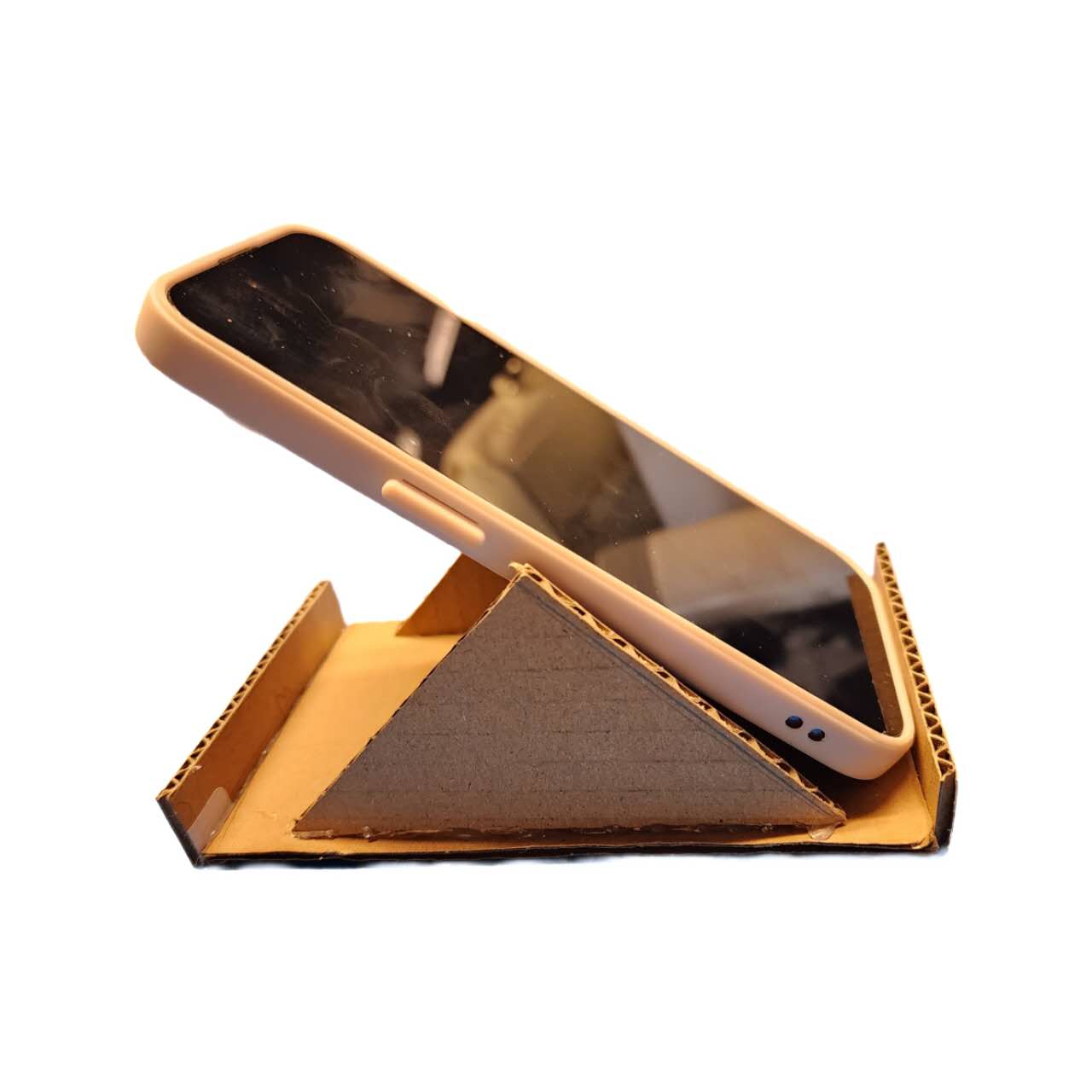 This was our first version based on the tutorial. It turns out the width was too wide for the phone, causing one side of the phone to sink and tilt upwards.